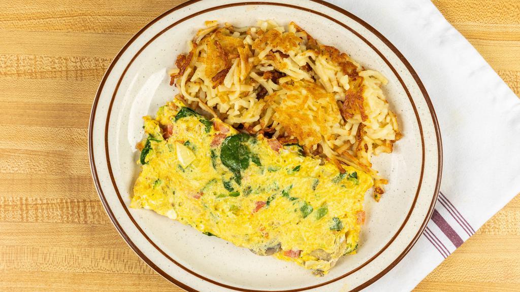 Veggie Omelet · made with 4 eggs Tomatoes, onions, green peppers, spinach, mushrooms, broccoli and American cheese.