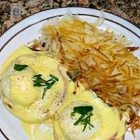 Eggs Benedict · Two poached eggs with ham off the bone on English muffin with hollandaise sauce