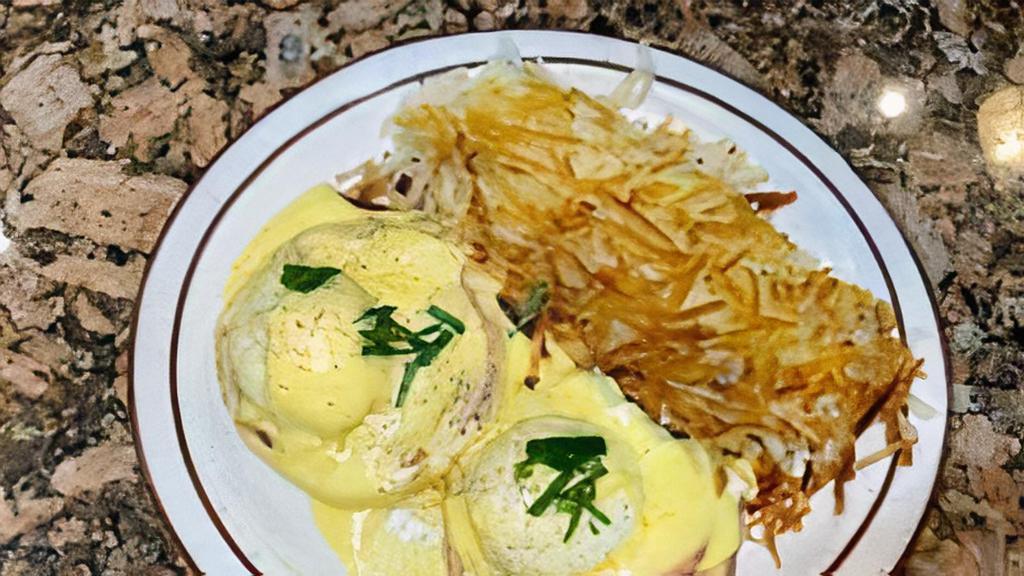Eggs Benedict · Two poached eggs with ham off the bone on English muffin with hollandaise sauce