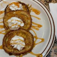 Cinnamon Rum French Toast · 4 thick slices of cinnamon rum French toast, dusted with cinnamon sugar and drizzled with ca...