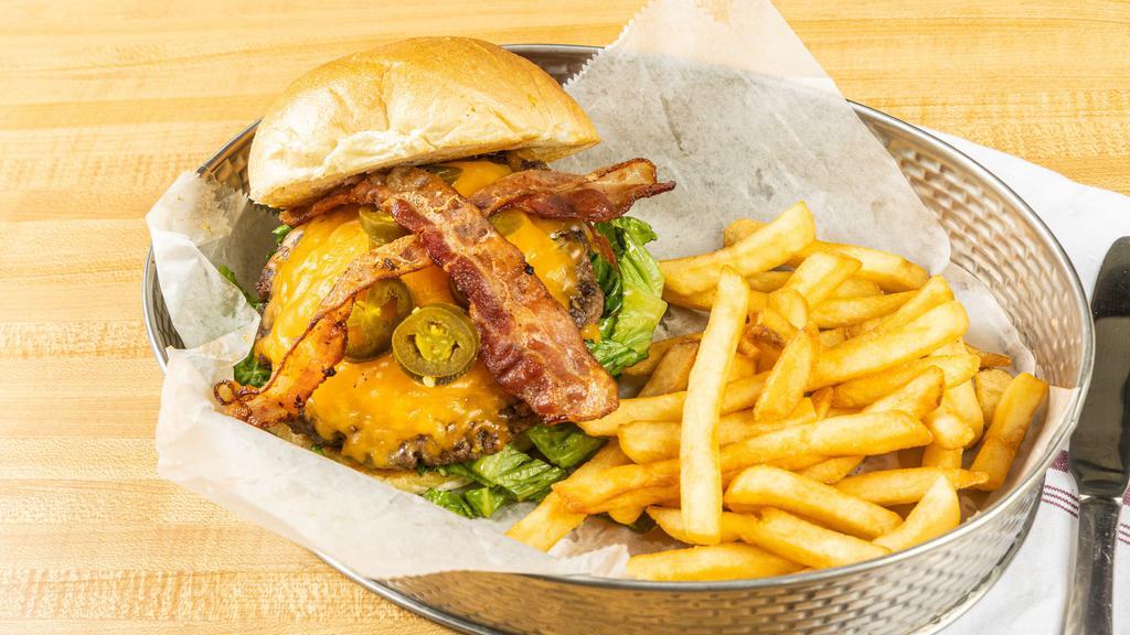 Jalapeno  Popper  Burger · 1/2 Pound  Burger with Jalapeno  poppers cheddar  cheese  and Bacon