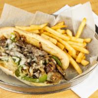 Philly Cheesesteak · Perfect Seasoned sirloin steak strips, sautéed peppers, mushrooms and onions topped with moz...