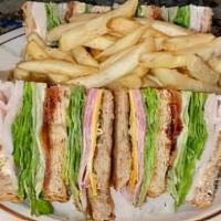 House Club · Triple decker club with ham, turkey, bacon, lettuce, tomatoes and American cheese on whole g...