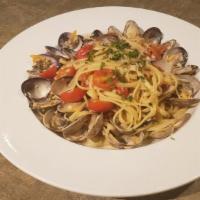 Linguine Alle Vongole · Long thin flat pasta sauteed with garlic, clams, grape tomatoes, red pepper flakes, white wi...
