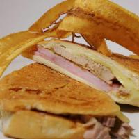 Classic Cuban Sandwich · Ham, Swiss cheese and roasted pork with pickles
