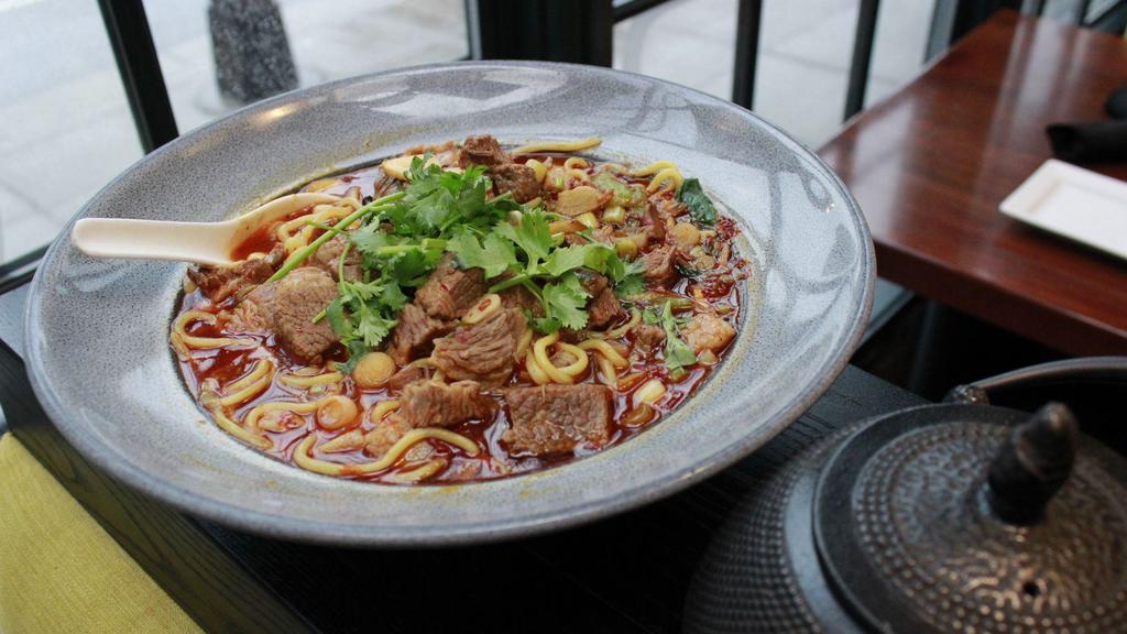 Spicy Szechuan Beef Noodle Soup · House made noodles, braised brisket, bok choy, pickled fresnos, fresh cilantro & green onion