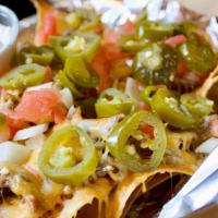 Vegetarian Nachos · Melted Cheddar and Jack Cheese , Veggie refried beans, tomato , jalapeños , onion with salsa...