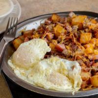 Meat Lover Skillet · Golden home fries topped with cheese, bacon, ham, sausage, and your choice of eggs.