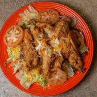 Chicken Salad · Choose fried or grilled chicken with sautéed mushrooms and onions served over a crispy lettu...
