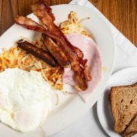  Perry Street Breakfast · Three eggs, two sausage, two bacon and one pieces ham with hash browns or grits, toast and j...