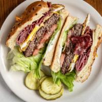 Big ‘O’ Sandwich · Hamburger patty on an onion roll with corned beef, a fried egg, lettuce, tomatoes, mayo, Swi...