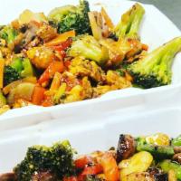 Chicken Stir Fry · Seasoned chicken breast sauteéd with assorted vegetables, served over rice.