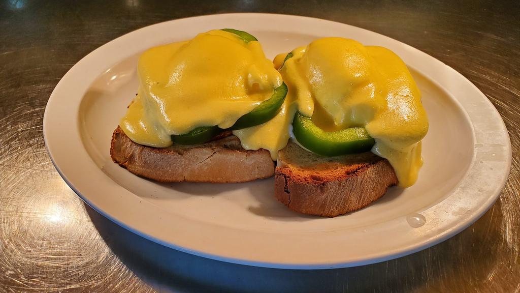 Egg  Benedict · Two poached Egg , Canadian bacon and green pepper on homemade toast and topped with hollandaise sauce.