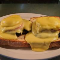 Egg  Florentine · Two poached Egg , spinach, and tomato on homemade toast and topped with hollandaise sauce.