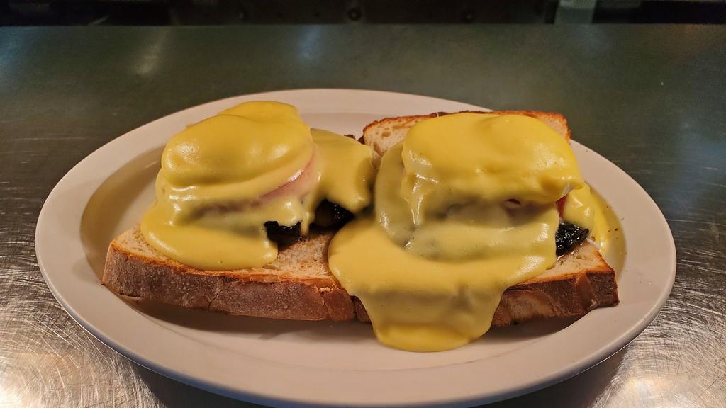 Egg  Florentine · Two poached Egg , spinach, and tomato on homemade toast and topped with hollandaise sauce.