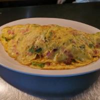 The Omelette · Three egg omelette stuffed with your choice of any four items from below.