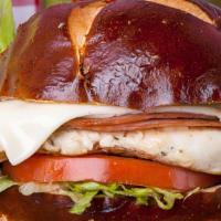 Malibu On Pretzel · Grilled Smoked Ham, Swiss Cheese, Lettuce, Tomato with side of Honey Dijon on a Pretzel Bun ...