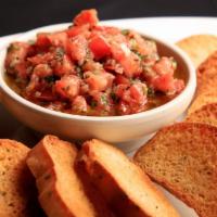 Bruschetta Appetizer · Roma tomatoes, olive oil, garlic, and spices served with toasted crostini.