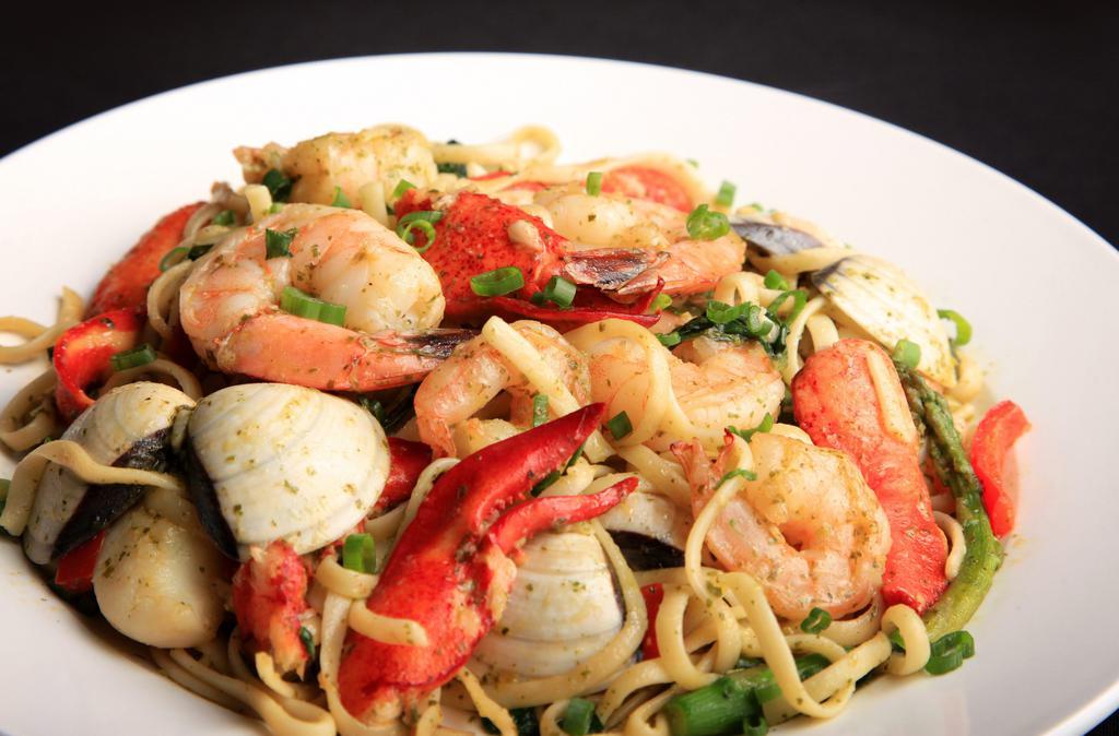 Linguini Pescatore · Shrimp, scallops, clams, lobster, peppers and spinach sautéed in olive oil garlic sauce with a hint of pesto.