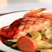Grilled Salmon · Gluten-free. Served with bourbon glaze sauce or lemon butter garlic sauce.  Served with rice...