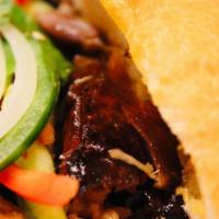 Roasted Duck- Sandwich · A truly unique banh mi and a personal favorite. Cuts of roasted duck hold the flavor of it a...