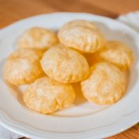 Paani Puri · Fried crisp dough filled with a mixture of flavored water, tamarind chutney, onions, chick p...