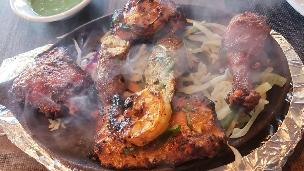 Tandoori Quadruple Play · Combination of four grilled delicacies-seekh kebab, malai chicken, tandoori chicken and shrimp.