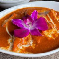 The Classic Butter Chicken · Roasted marinated chicken breast pieces cooked in a yogurt base, butter slowly simmered in a...