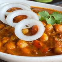 Chana Pindi · Preparation of chickpeas in onions and tomato gravy perfected by Chef’s special sauce. Recom...