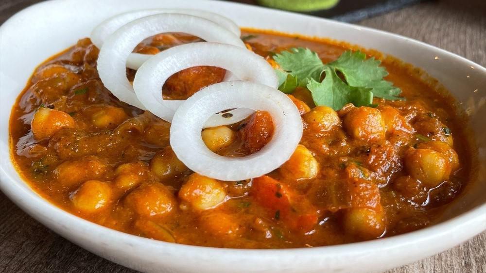 Chana Pindi · Preparation of chickpeas in onions and tomato gravy perfected by Chef’s special sauce. Recommended with bhatura (fried bread).
