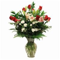 Premium Dozen Roses · Premium 70cm red roses professionally designed in an 11 inch garden vase