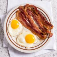 2 Eggs, Choice Of 4 Meats, Toast & Jelly · Choice of four pieces of bacon, four sausages, or three pieces of ham.