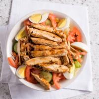 Grilled Chicken Salad · Grilled chicken, American and Swiss cheese, boiled egg, cucumber, lettuce, tomato and pita b...