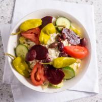 Greek Salad · Lettuce, tomato, cucumber, onion, beets, pepperoncini, feta, olive, and pita bread.