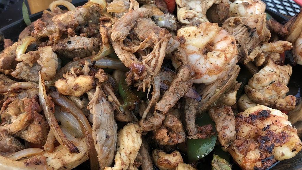 Fajitas Mi Pueblo · Steak, chicken, shrimp, chorizo, and carnitas.