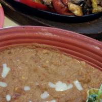 Vegetarian Fajitas · A healthy mix of grilled onions, squash, bell peppers, tomatoes, and mushrooms. Served with ...