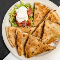 Quesadillas · A flour tortilla folded in half with melted cheddar jack cheese served with salsa and sour c...