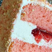 Strawberry Crunch Cake Slice · Freshly made strawberry cake with vanilla buttercream & strawberry filling.