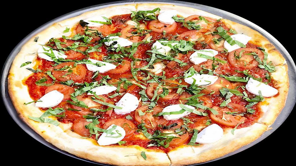 Margherita Pizza · Fresh mozzarella, fresh sliced tomatoes, tomato sauce & basil leaves.