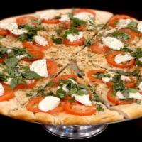 Caprese Pizza · Fresh mozzarella, fresh sliced tomatoes & basil leaves.