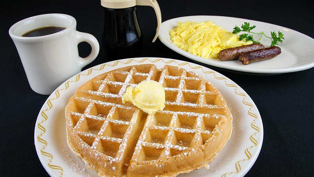 Belgian Waffle Special · Served with two eggs, bacon or sausage.

Consuming raw or under-cooked meats, poultry, seafood or eggs may pose an increased risk of food-borne illness.