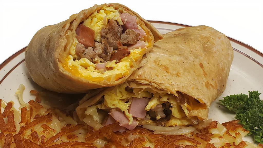 Meat Lovers Wrap · A wrap loaded with scrambled eggs, bacon, sausage, ham and cheddar cheese.
Served with your choice of potatoes