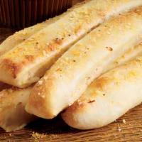 Breadsticks · 8 Fresh-baked breadsticks with garlic and Italian spices served with cheese sauce and pizza ...