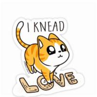Knead Love Cat Vinyl Sticker · Sticker of an orange tabby kneading with the text 