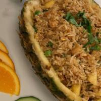 Pineapple Fried Rice · Scrambled egg, mixed vegetable, chicken, peanut, sliced tomato, and cilantro served with swe...