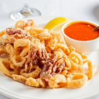 Calamari Fritti · Golden fried calamari served with a side of marinara sauce.
