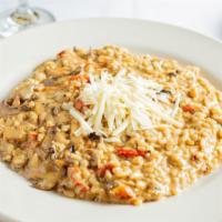 Risotto Nocerina · Risotto with mushrooms, sun-dried tomatoes and porcini mushrooms in a cream sauce. Add chick...