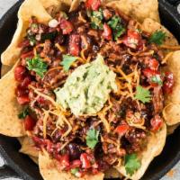 American Spicy Beef Nachos · Freshly fried tortilla chips topped with spicy beef, cilantro, onions and three cheese blend.
