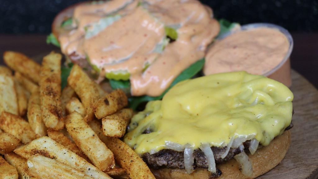 Got Burger · Served with American Cheese, lettuce, tomato, pickles, grilled onions, and spicy Chipotle mayo.