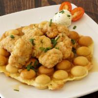 Chicken & Waffle · Bubble waffle, gf chicken chunks, maple syrup, garlic butterball and chives.